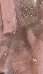 Dusty rose organza silk laid flat on the table