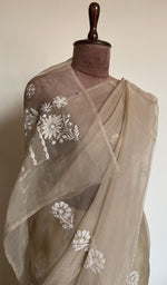 Beige saree on the mannequin, close view