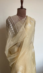 Butter yellow saree on the mannequin, close view