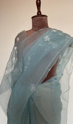 Fine do taar chikankari on border and palla on the sky blue saree