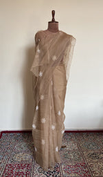 Camel beige organza silk saree draped on the mannequin, front view