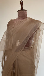 Fine do taar chikankari on border and palla on the camel beige saree