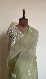 Sage green saree on the mannequin, close view