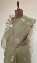 Fine do taar chikankari on border and palla on the sage green saree