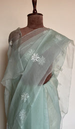 Fine do taar chikankari on border and palla on the aqua saree