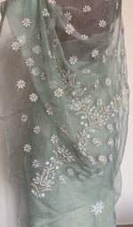 Embroidery on the aqua saree, close view