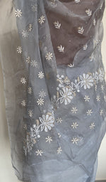 Embroidery on the powder blue saree, close view