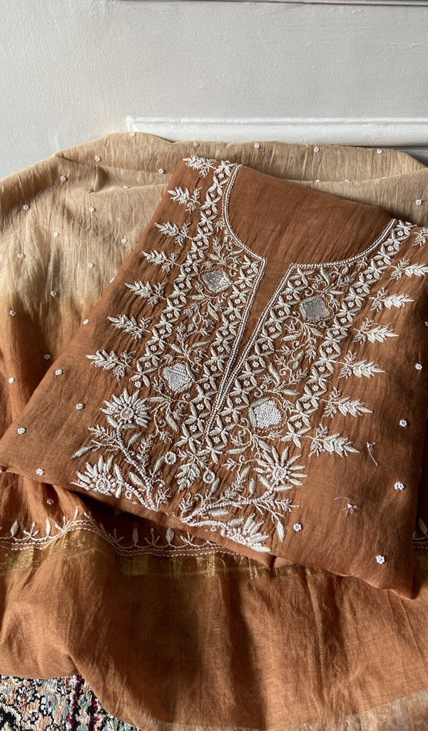 Rust mul chanderi kurta piece folded, badla and mukaish work in view