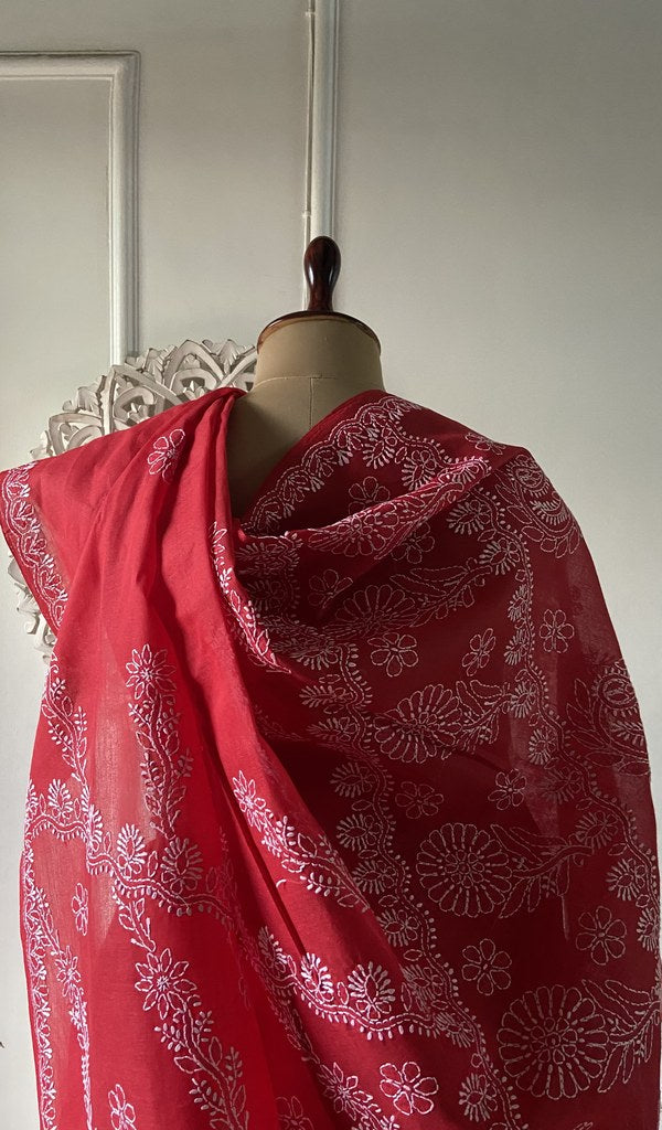 Close view of the stitchwork on the red saree