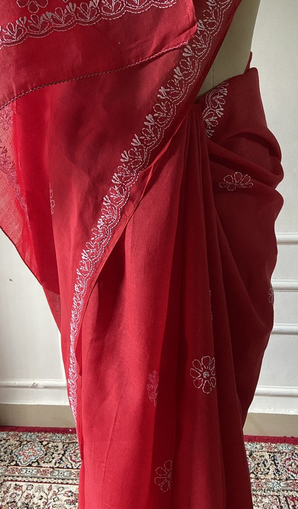 Red saree draped to show the fall of the fabric