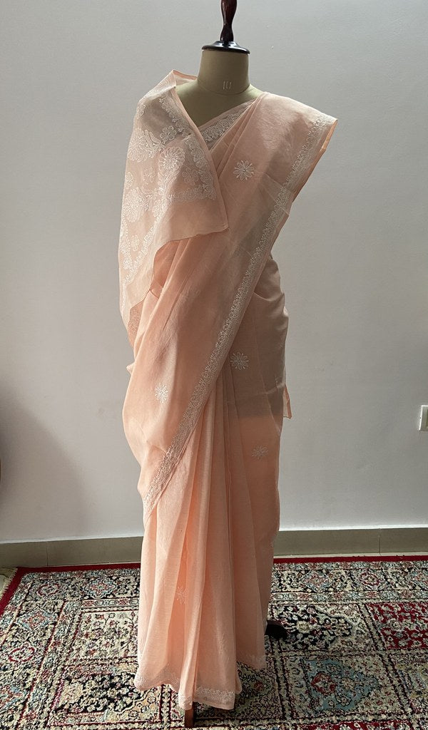 Peach cotton voile chikankari saree draped on the mannequin