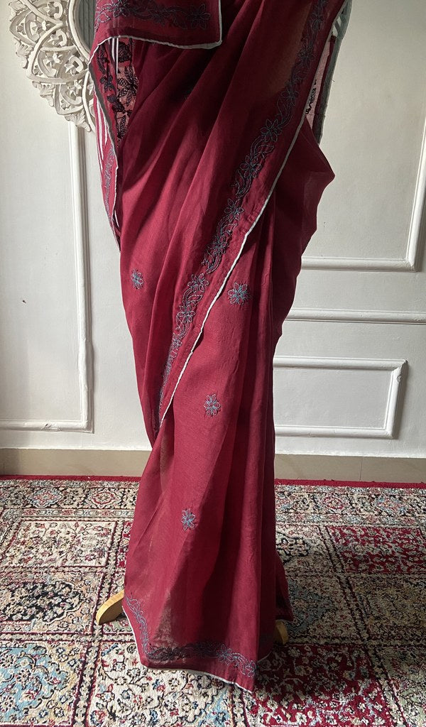 Pallu of the maroon saree, chikankari worked across it