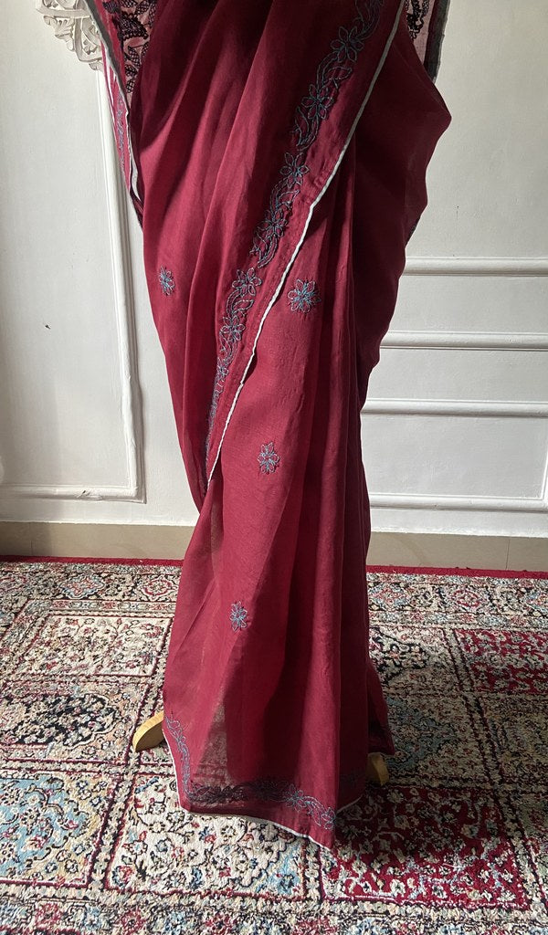 Pallu folded over the shoulder, work visible