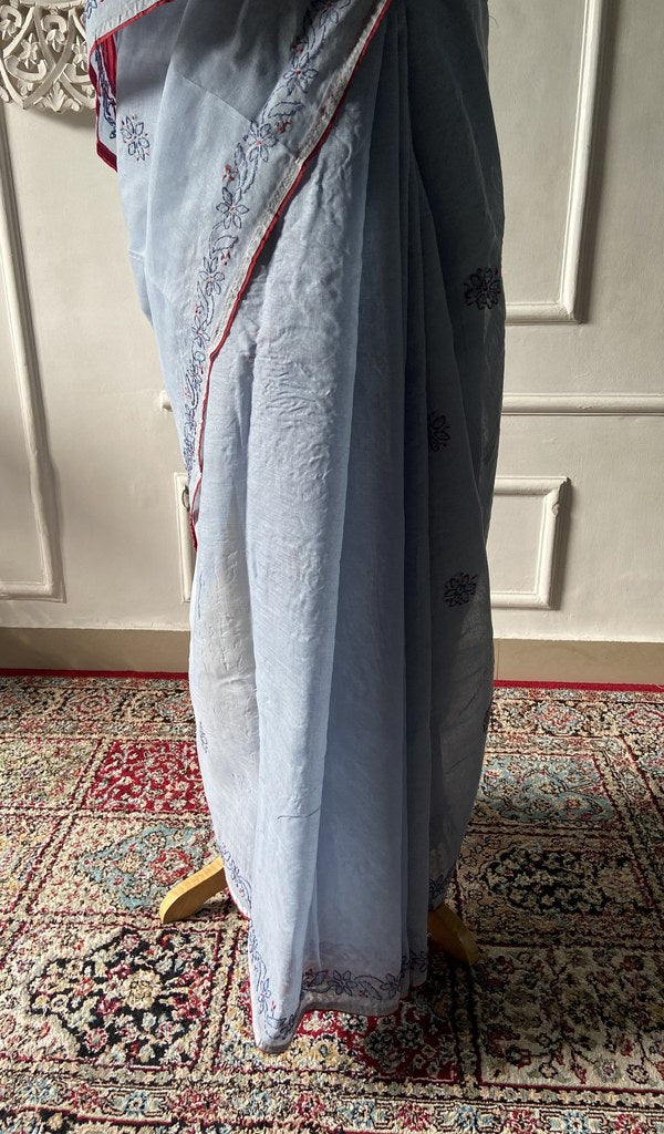 Pallu folded over the shoulder, work visible