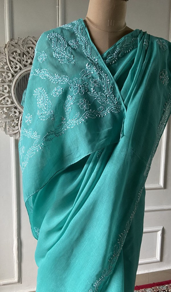 Pallu of the turquoise saree, chikankari worked across it