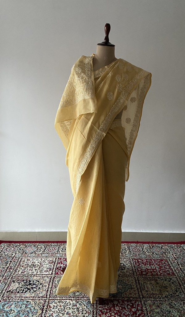 Yellow cotton voile chikankari saree draped on the mannequin
