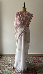 White cotton voile chikankari saree draped on the mannequin