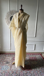 Load image into Gallery viewer, Pale yellow cotton voile chikankari saree draped on the mannequin