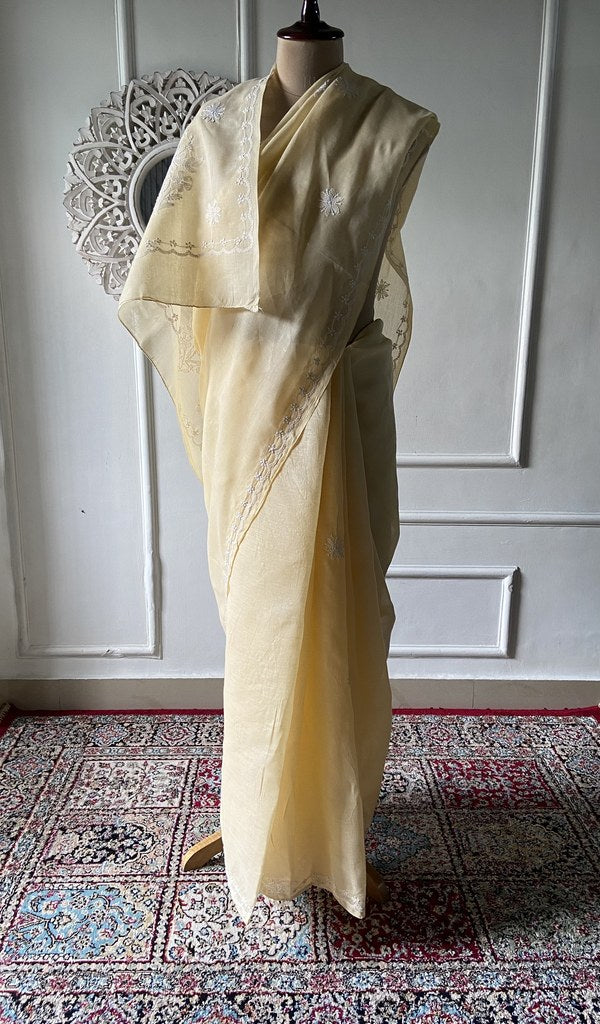 Body of the pale yellow saree, chikankari across the ground