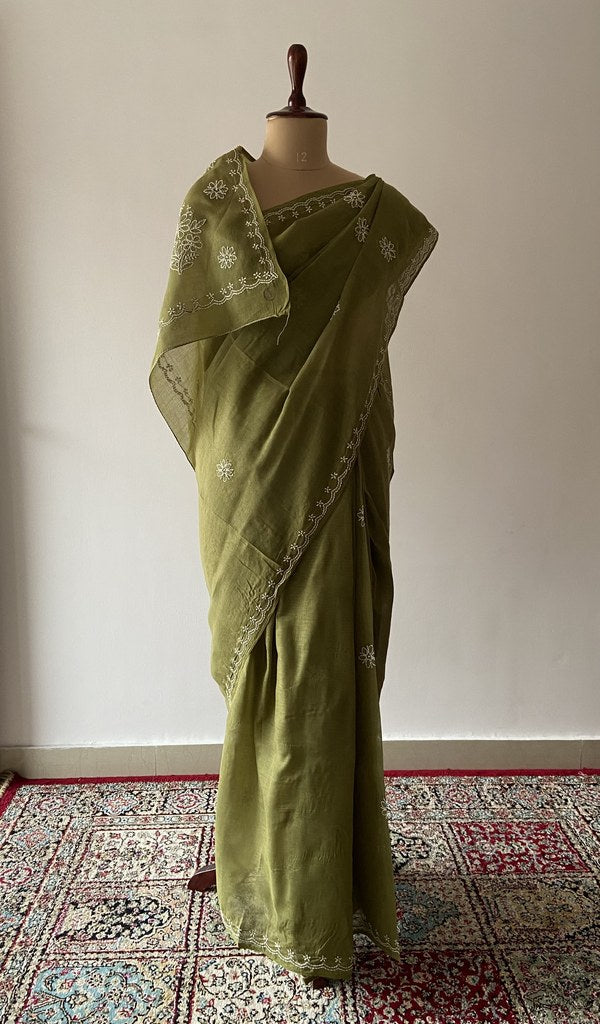 Olive Green cotton voile chikankari saree draped on the mannequin