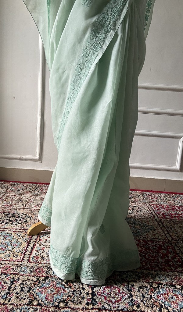 Border detail on the sea green cotton voile saree
