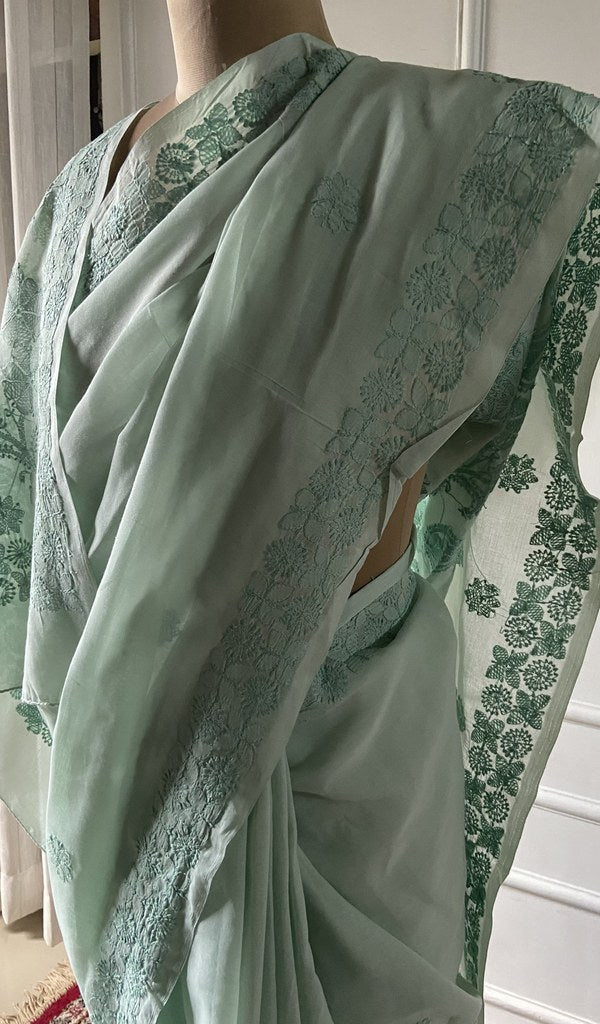 Pallu folded over the shoulder, work visible