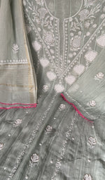 Motifs across the body of the green kurta