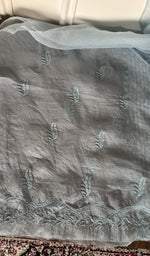 The sky blue kurta, spread out flat