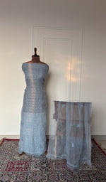 Sky blue organza silk set on the mannequin with its dupatta