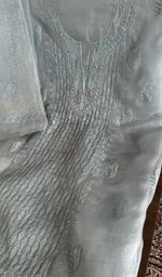 Sky blue organza silk laid out flat