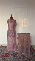Dusty rose organza silk set on the mannequin with its dupatta