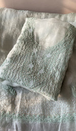 Folded mint green organza silk kurta, front view