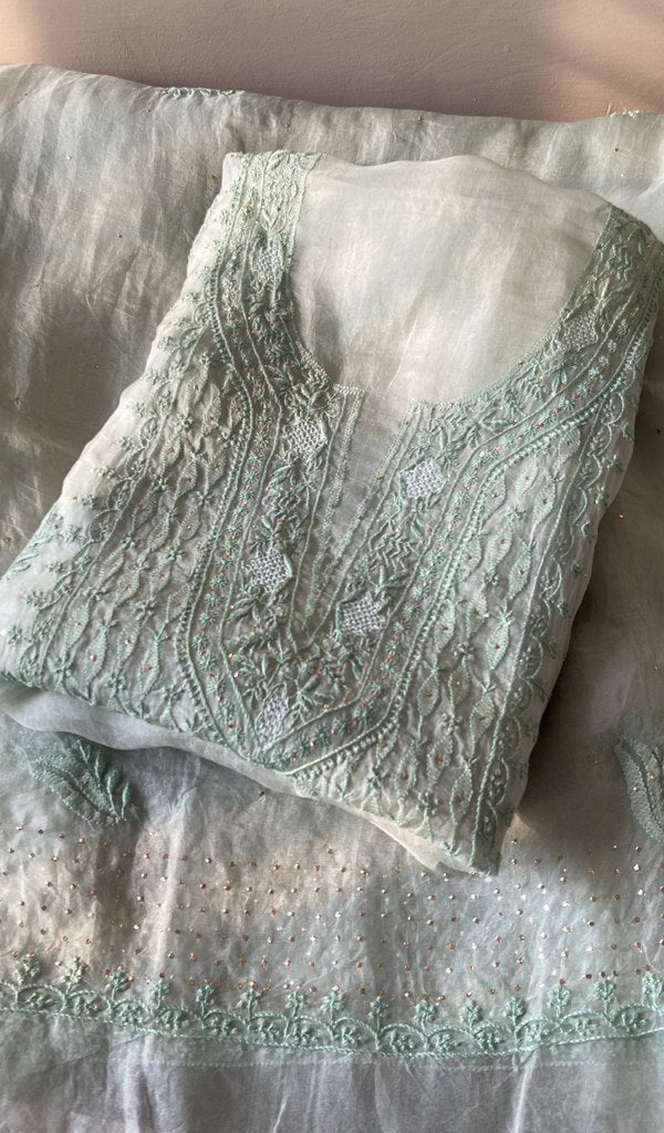 Folded mint green organza silk kurta, front view