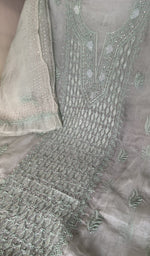Mint green organza silk laid out flat
