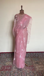 Pink organza silk saree draped on the mannequin, front view