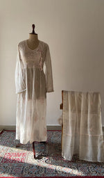 The set on the mannequin with its dupatta beside it
