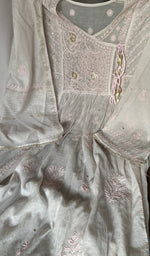 Motifs across the body of the grey kurta
