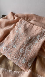 Folded kurta piece and dupatta, chikankari along the hem