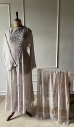 The set on the mannequin with its dupatta beside it
