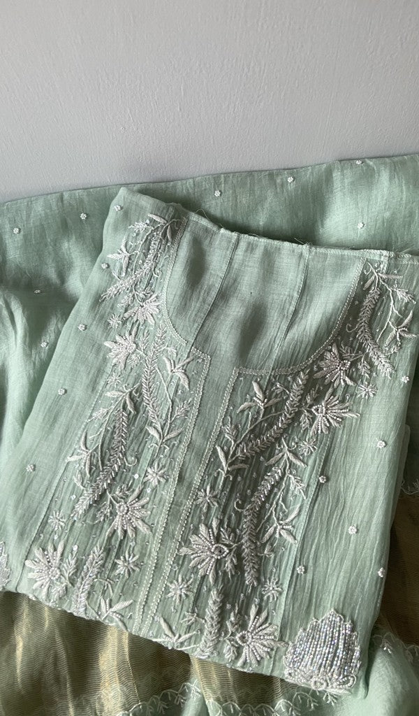 Green pure mul chanderi kurta piece folded, fine front and back jaaldar chikankari anarkali