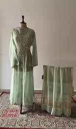 The set on the mannequin with its dupatta beside it