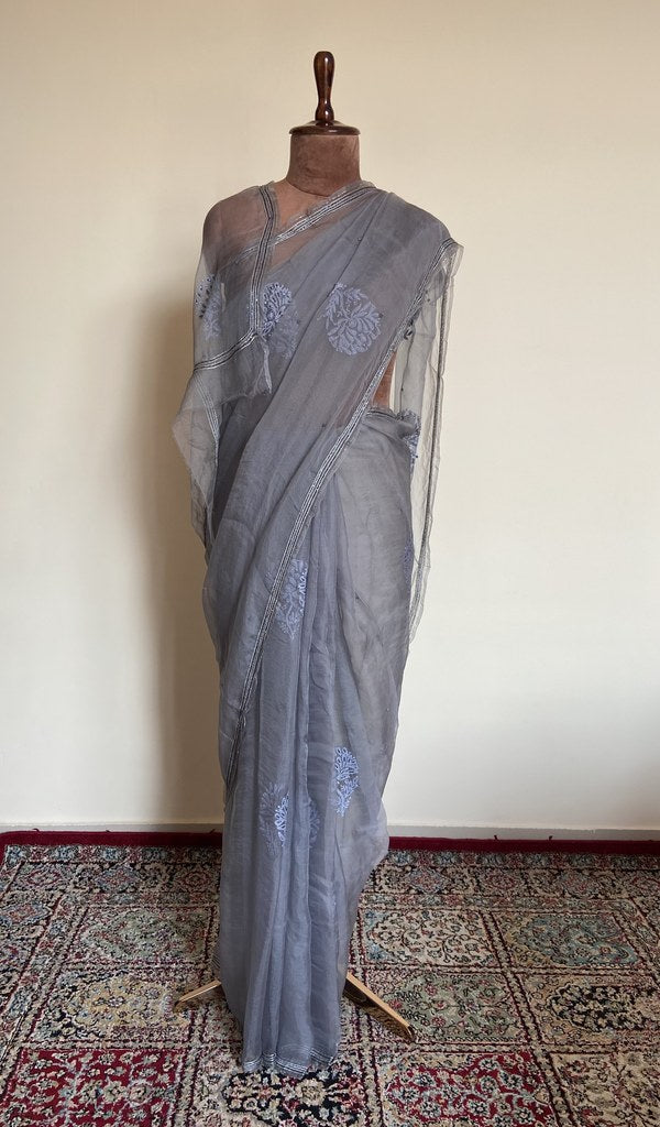 Grey organza silk saree draped on the mannequin, front view
