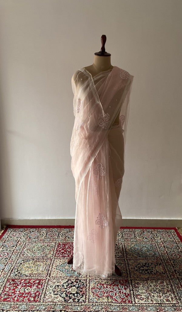 Pink pure organza silk saree draped on the mannequin