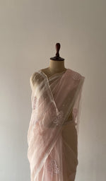 Pallu falling over the shoulder, do taar and teen taar chikankari motifs on pallu and allover