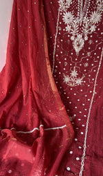 Badla work and beadwork across the body of the kurta piece