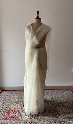 Ivory pure organza silk saree draped on the mannequin