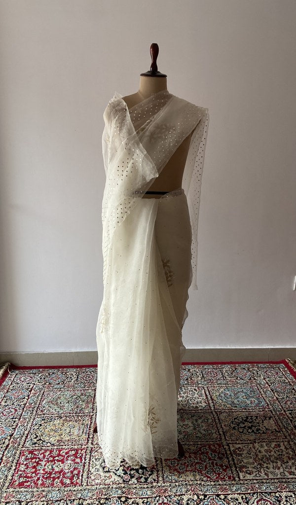 Ivory pure organza silk saree draped on the mannequin