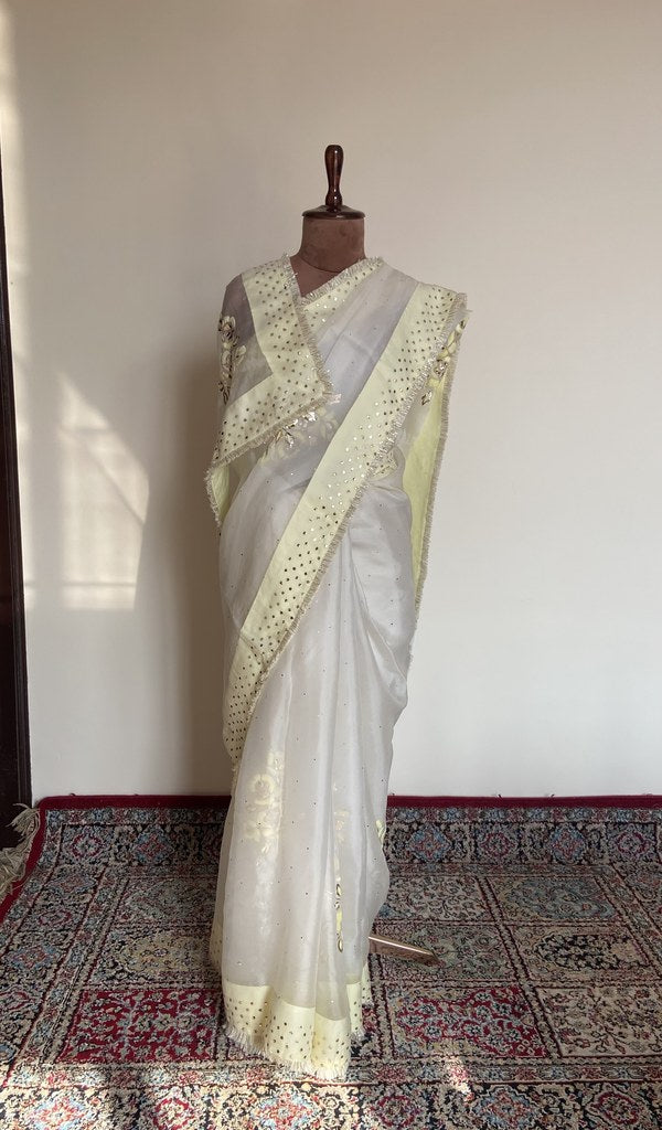 White organza silk saree draped on the mannequin, front view