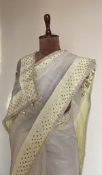 Fine do taar resham work on the white saree