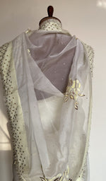 Embroidery on the white saree, close view